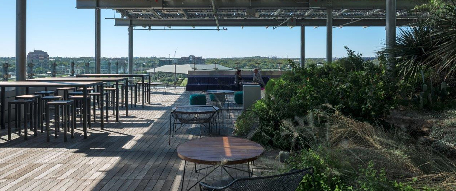 Covered Rooftop Seating Area with Greenery Covered Rooftop Seating Area with Greenery